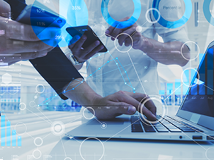 A person on a laptop with technological icons superimposed over their hand and computer.