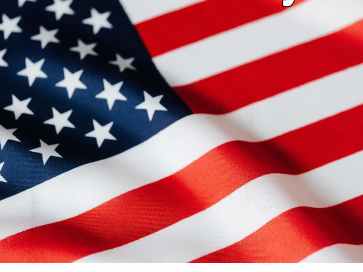 Up close image of the American flag with State Holiday written across the top.