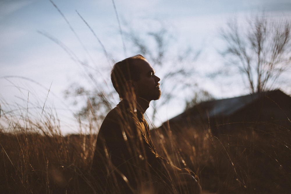 man in long grass