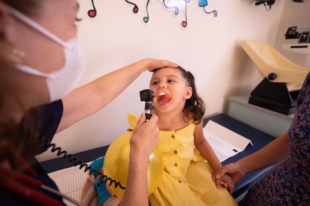 Girl in yellow dress at the dentist's office.