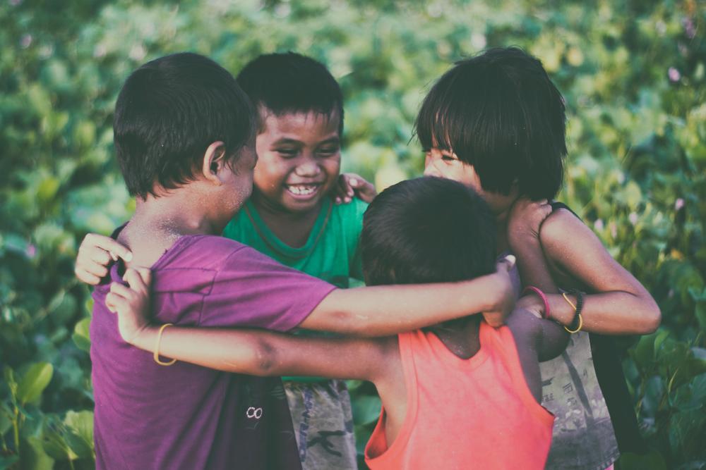 Children in a circle playing.