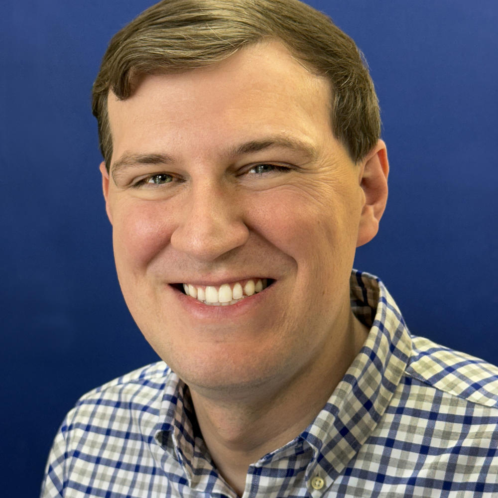 Photo of male employee on blue background 