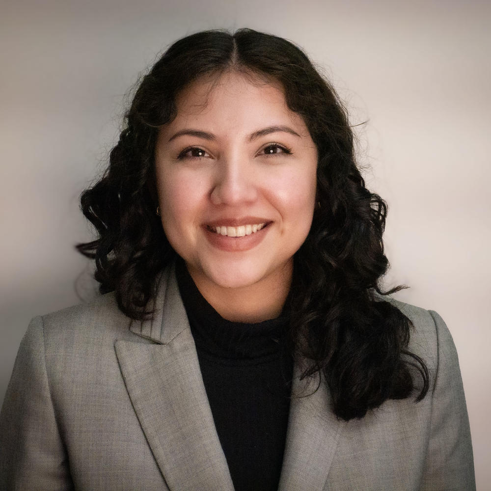 Female headshot on tan background